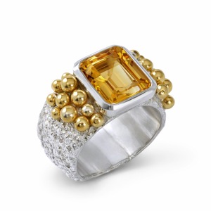 Handcrafted silver citrine gemstone ring featuring a vibrant citrine gemstone, adorned with sculptural gold accents. A bold artisan design for elegant and sophisticated styling.