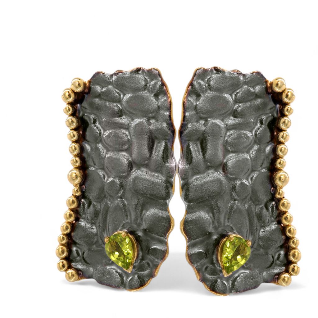 Silver earrings with an organic textured design, gold-plated and black rhodium-plated finish, and pear-cut peridot gemstones by Dono Di Dio Jewels.