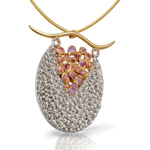 Handmade silver pendant with textured surface and gold-plated detail, featuring multicolored rough sapphires set in an organic composition,
